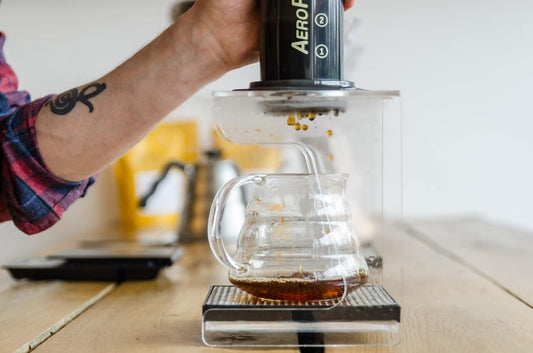 man brewing coffee
